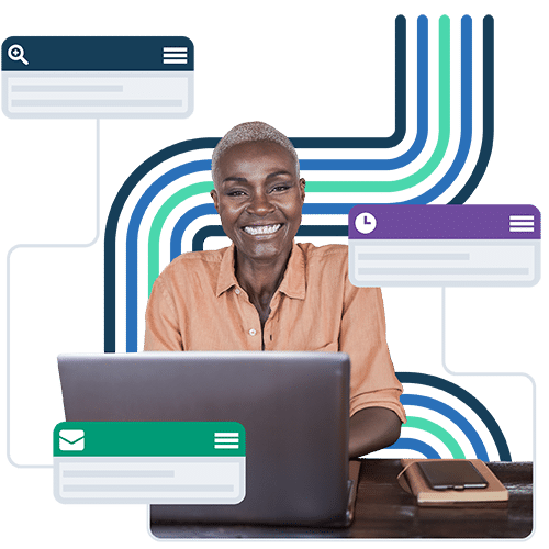 Smiling African American woman sitting at a desk with an open laptop